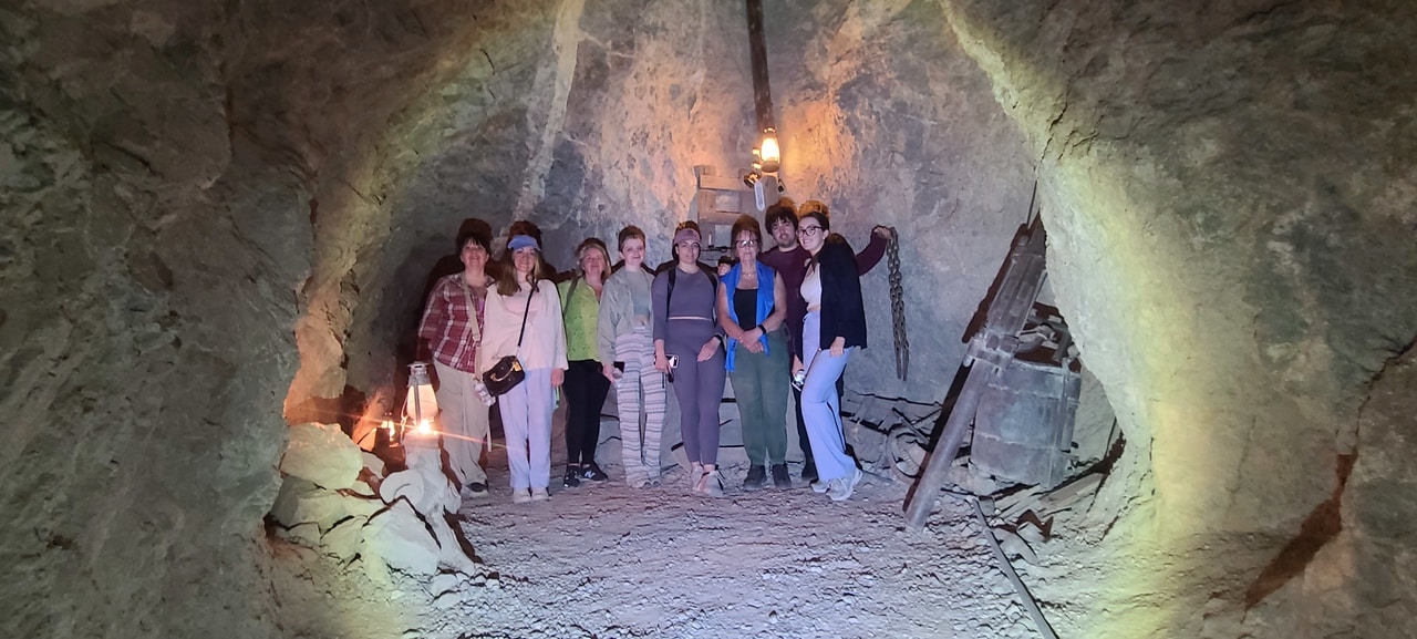 people posing for photo in the Techatticup Gold Mine seen during an ATV/RZR Gold Mine Tour in Las Vegas