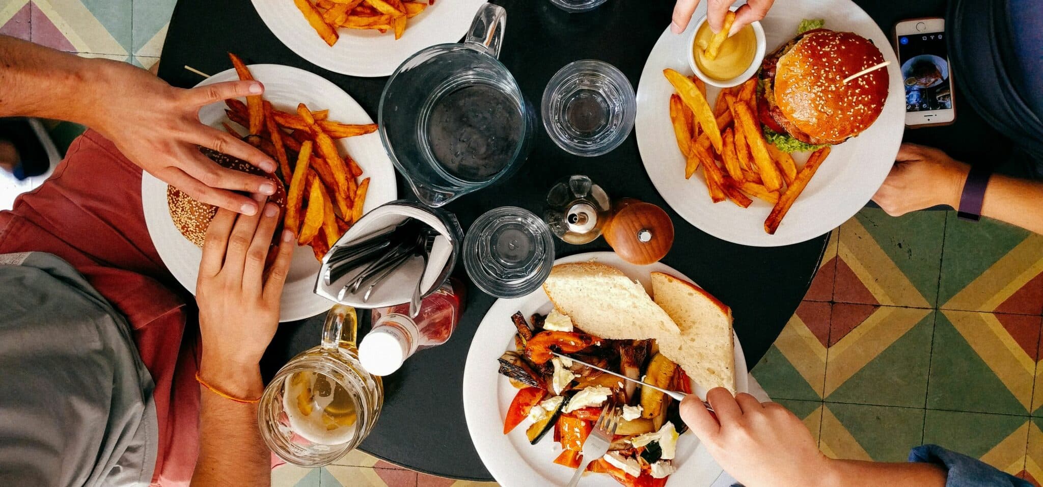 People eating burgers and fries