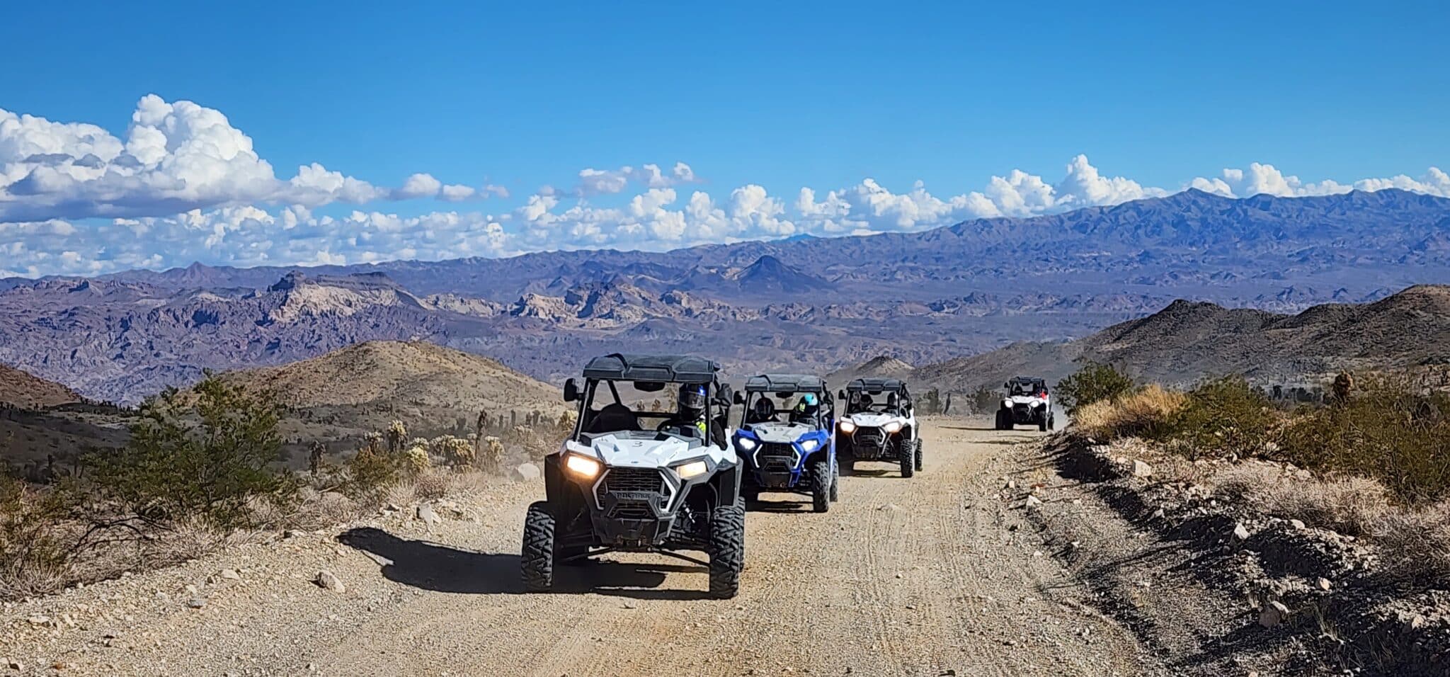 people riding Polaris RZRs on a UTV tour in Las Vegas